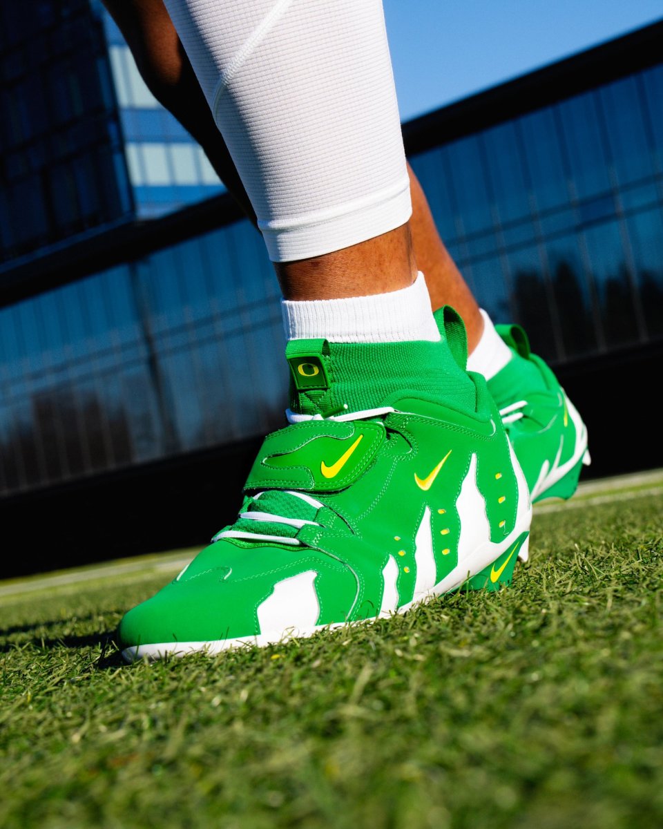 Oregon Ducks defensive lineman Brandon Dorlus models a uniform for the Pac-12 Championship against Washington.